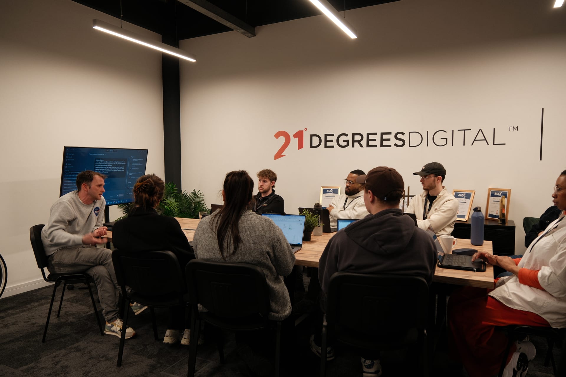 The 21 Degrees team working together in the studio.