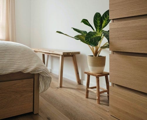A calm bedroom with natural wood flooring.