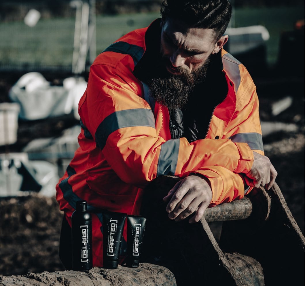 A man in workwear with Grafted products.