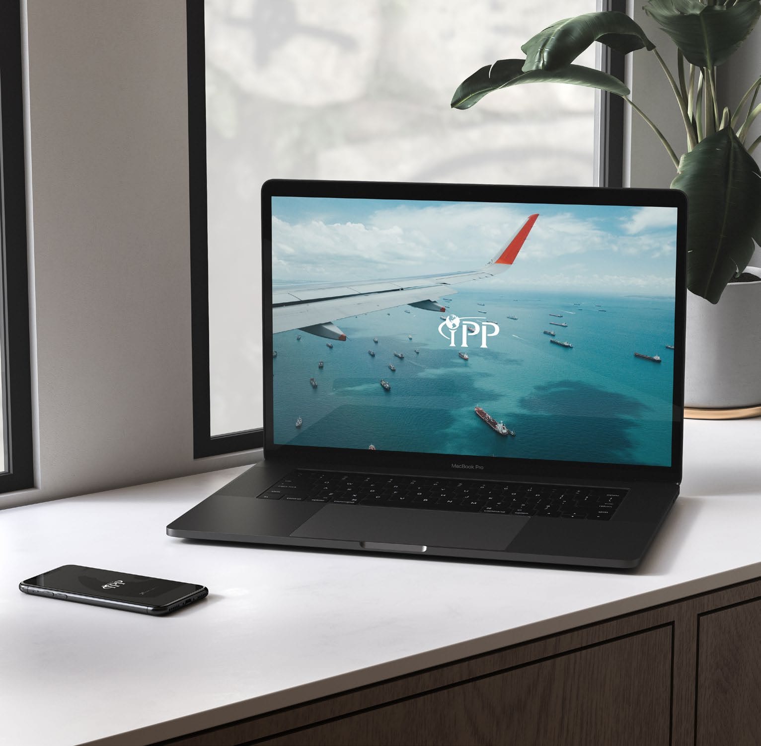 IPP website and phone on a desk.