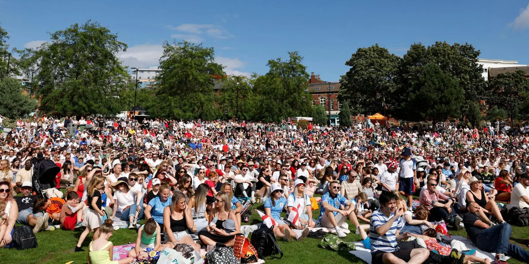 A large sunny crowd on the grass at the Fan City Sheffield fan zone.