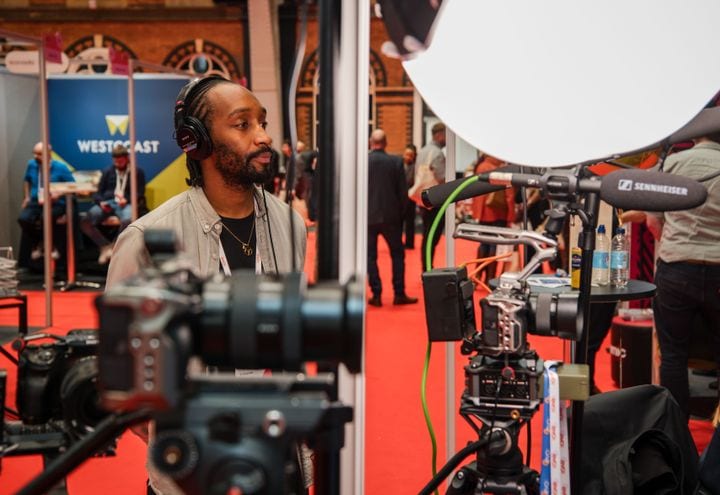 A 21 Degrees videographer at an industry event.