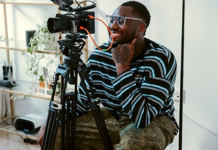 A 21 Degrees videographer filming on location.