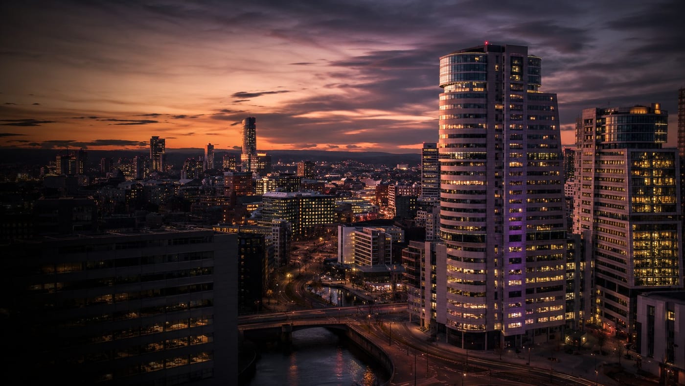 A financial-district skyline at dusk above reflective water, representing financial services marketing.